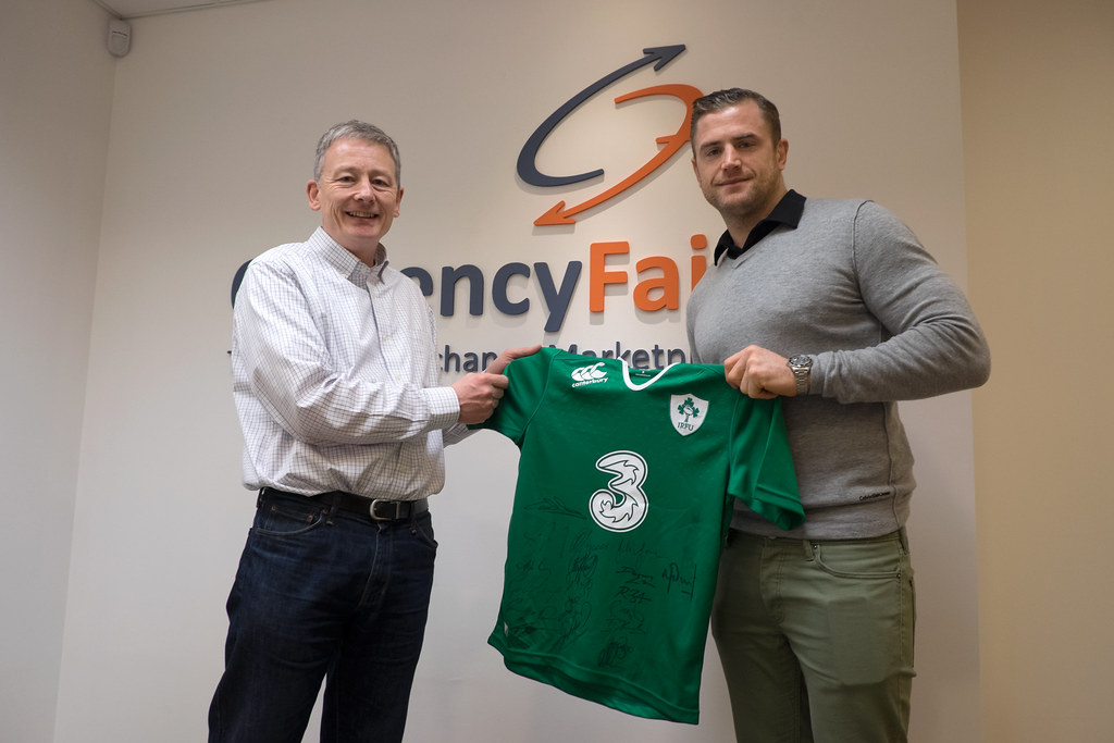 Jamie Heaslip hands over irish team signed tshirt to CurrencyFair COO-money tansfer