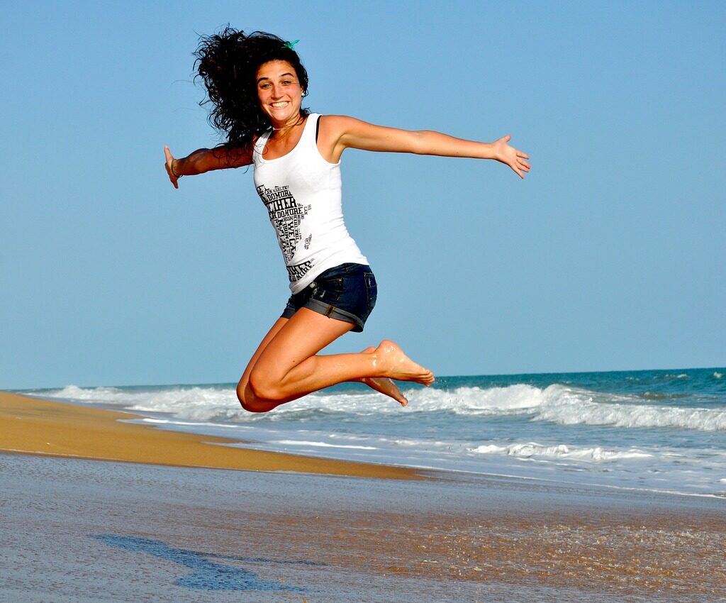 woman beach jump happy woman 332278